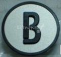 Нажимной элемент кнопки Коне серый символ "B" знак черный